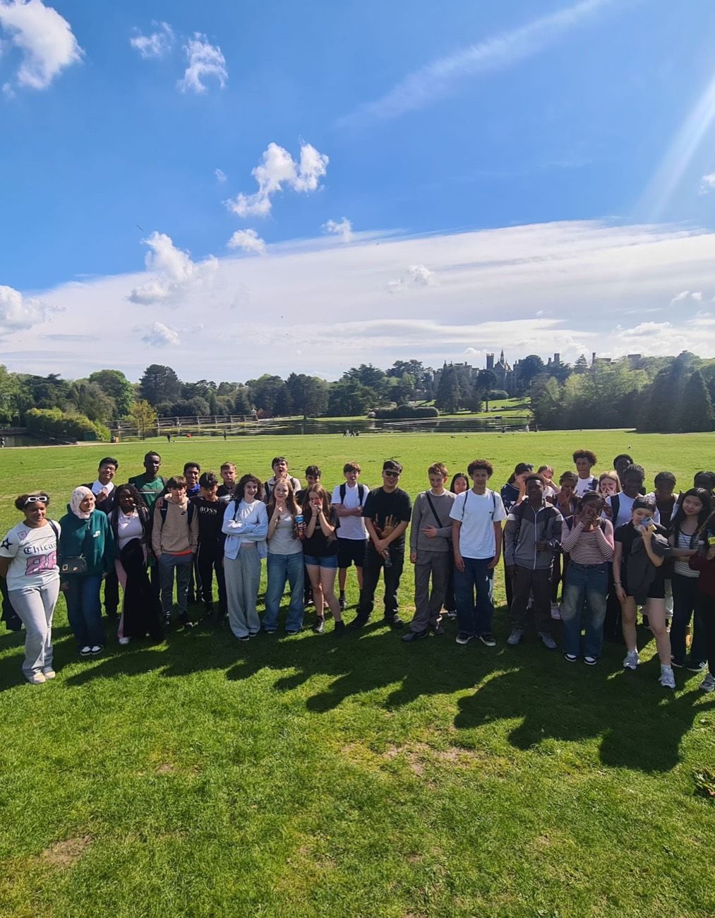 A school trip to Alton Towers funded by Ordernised, the group together on the lawn below the Towers