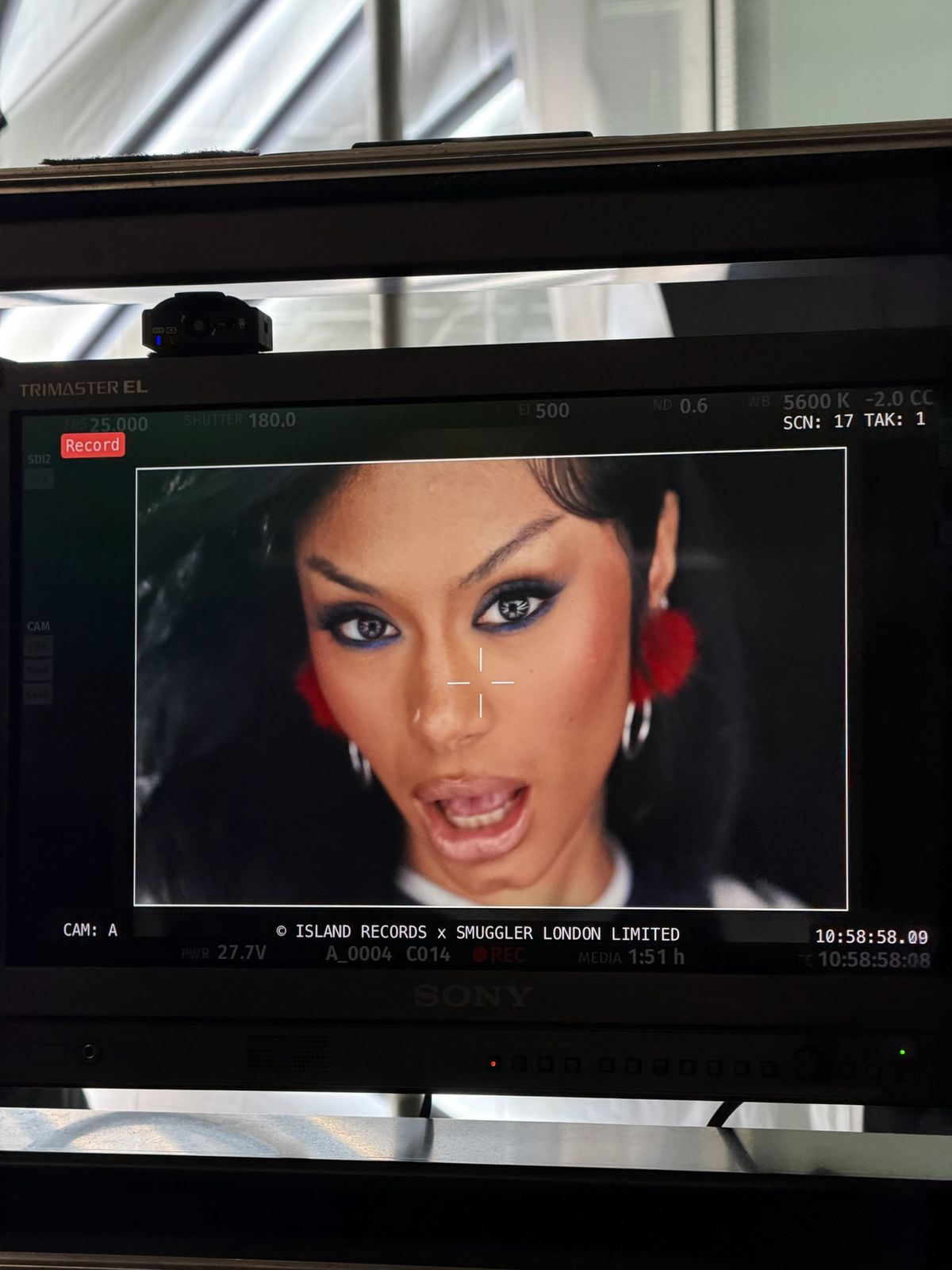 A music video close up playing back on the set monitor