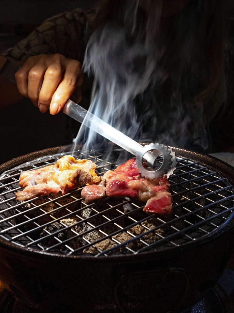Meat on the charcoal grill at Jinseon Korean BBQ