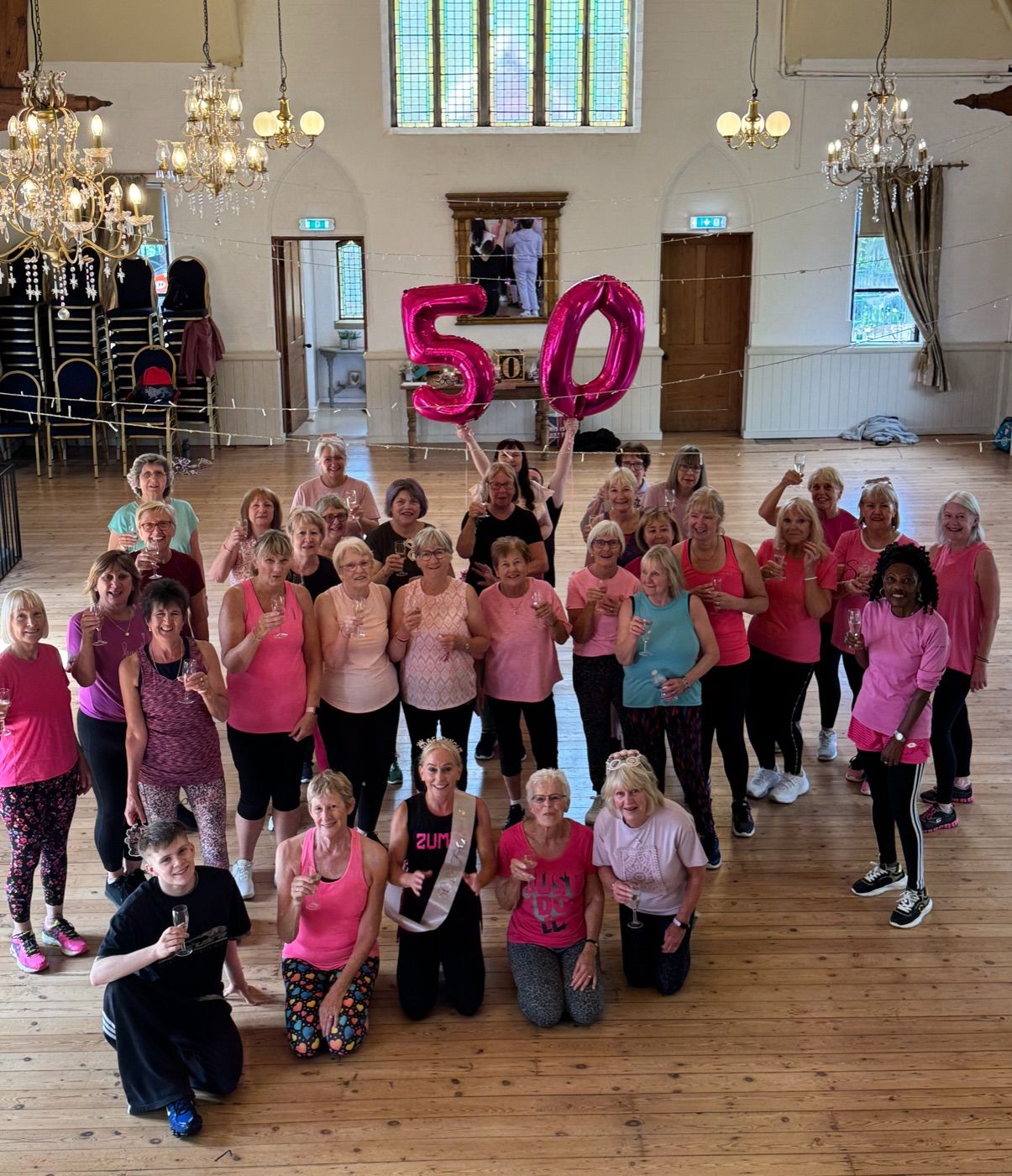 A large weekly exercise class gathered in the hall