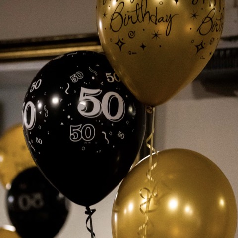 Balloons above a dressed table