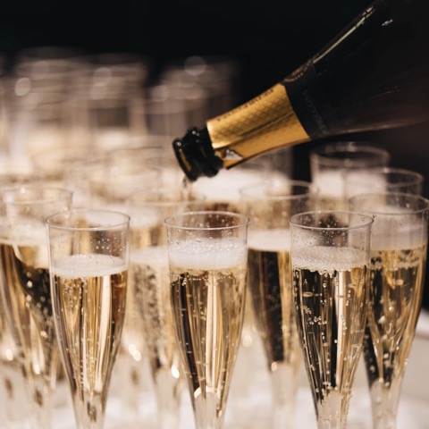 Champagne poured into a tray of flutes